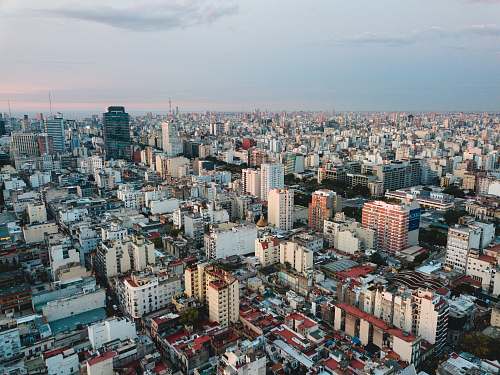 aerial view aerial view of city under cloudy sky during daytime landscape